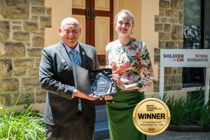 Prue an Ivan holding award