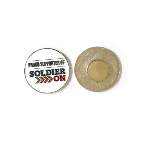 Front and back of round enamel lapel pin. The front is white with the words proud supporter of Soldier On in dark grey and red. The back shows a magnet clasp.